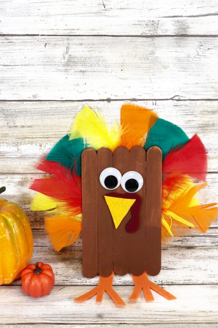 popsicle turkey craft with colorful feathers