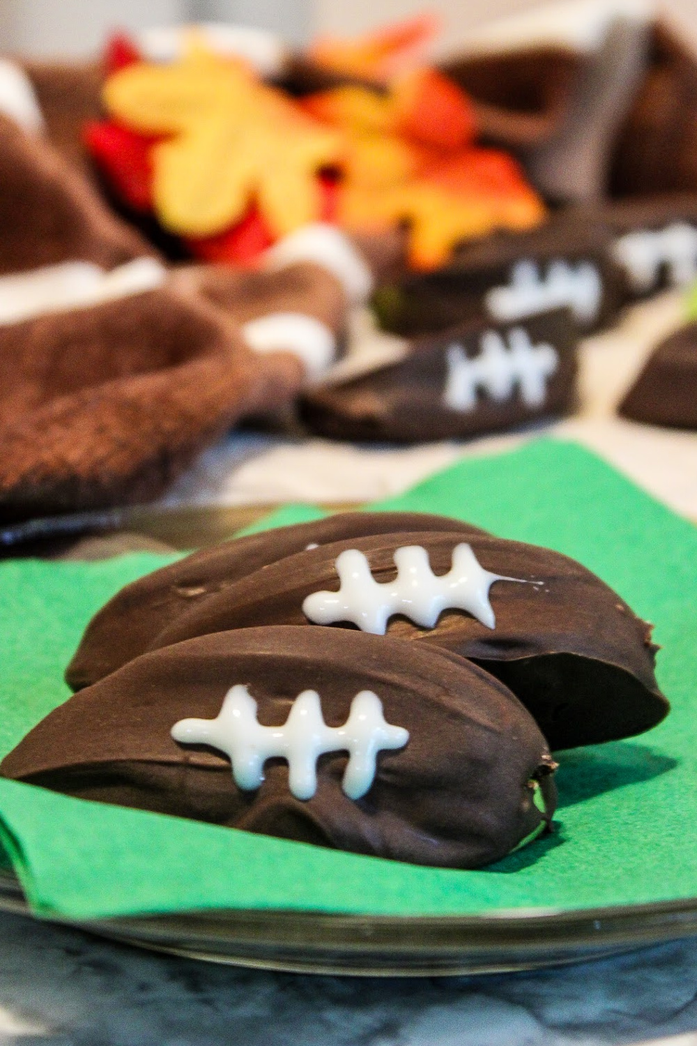 footballs that are covered with chocolate and shaped like footballs