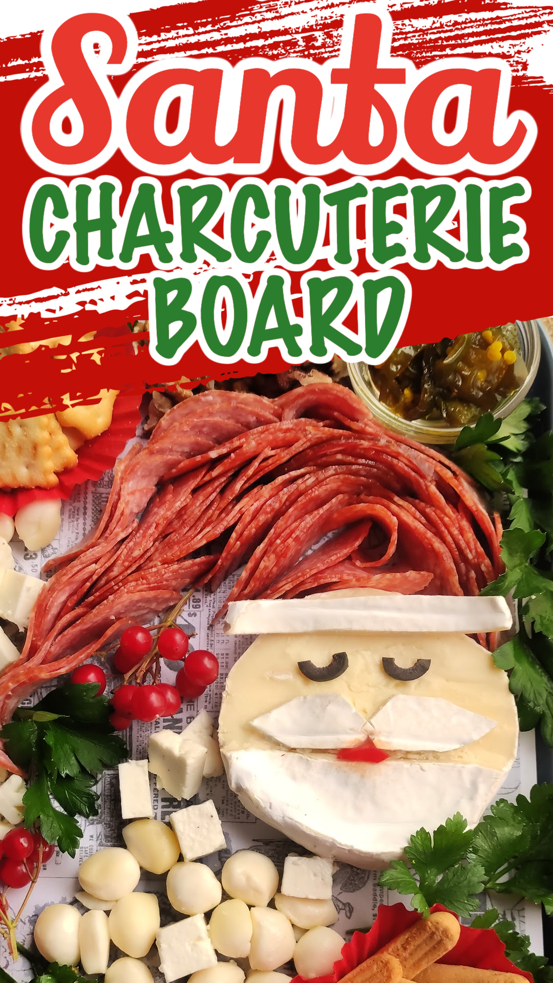 pin image of Santa Charcuterie Board. Santa is made out of brie cheese with a salami Santa hat.