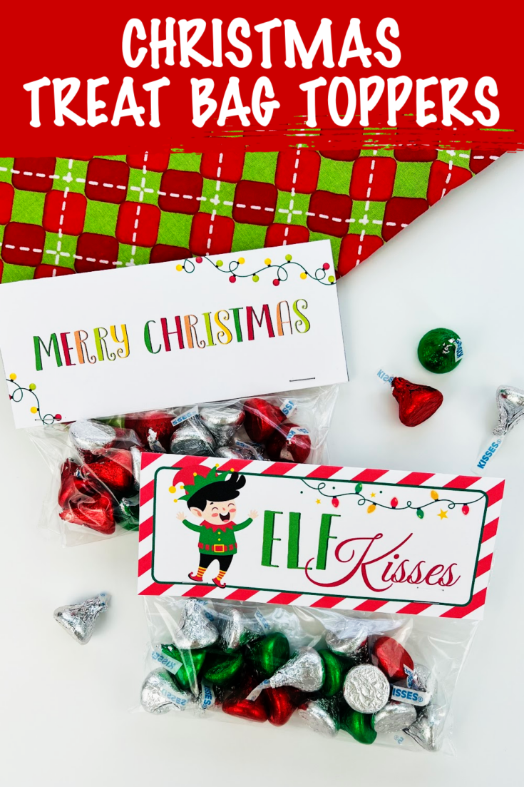 On a bright red and green background are treat bags filled with Hershey kisses. These Elf Kisses bag toppers and Merry Christmas bag toppers make the best gifts!