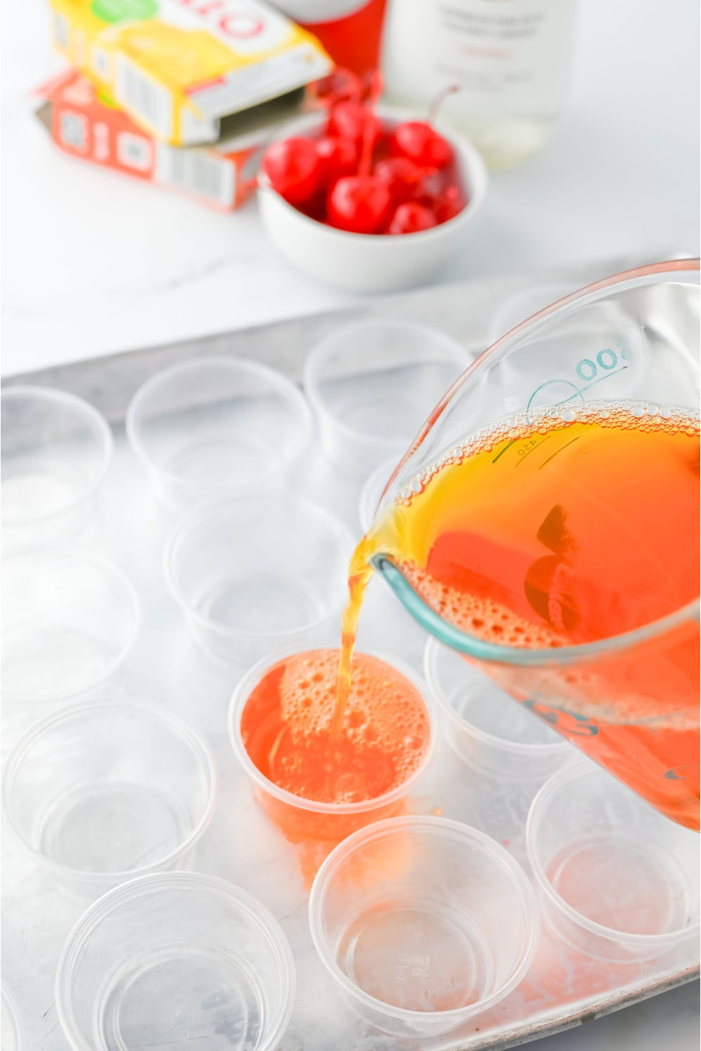 Pour the liquid jello into plastic shot glasses