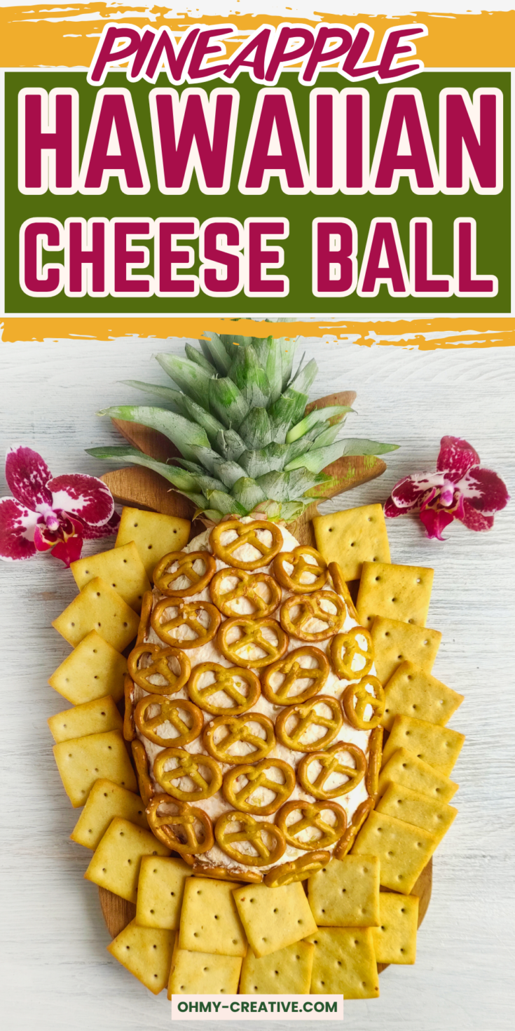 A pineapple-shaped Hawaiian cheese ball covered with mini pretzels and garnished with pineapple leaves, surrounded by square crackers on a white wooden surface. Text overlay reads 'Pineapple Hawaiian Cheese Ball' with the website ohmy-creative.com.