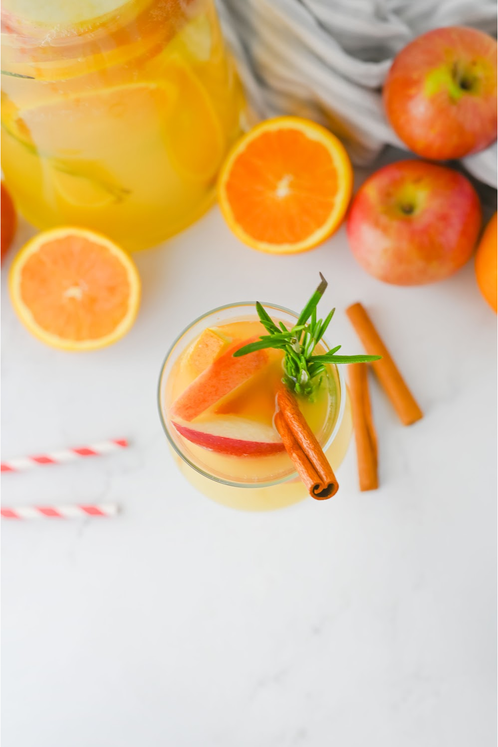 Top view or the harvest punch with apple slices and cinnamon sticks for garnish.